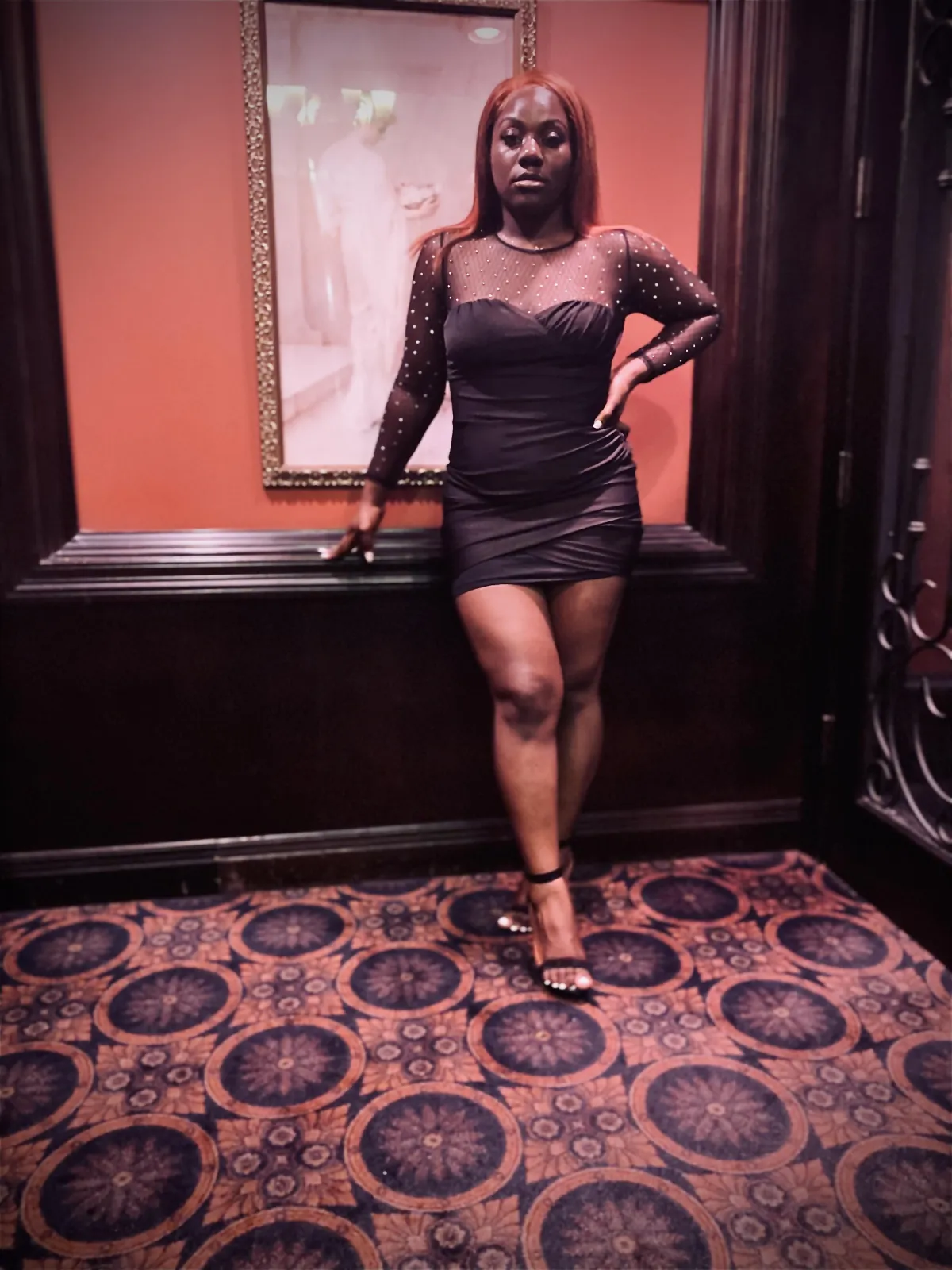 a large wooden table in a room with lots of windows