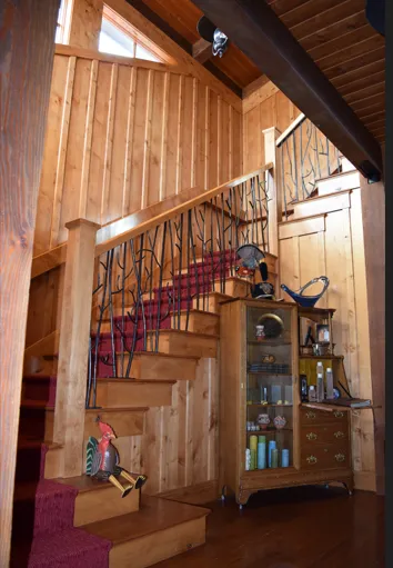 Custom Wood staircase with black metal railing