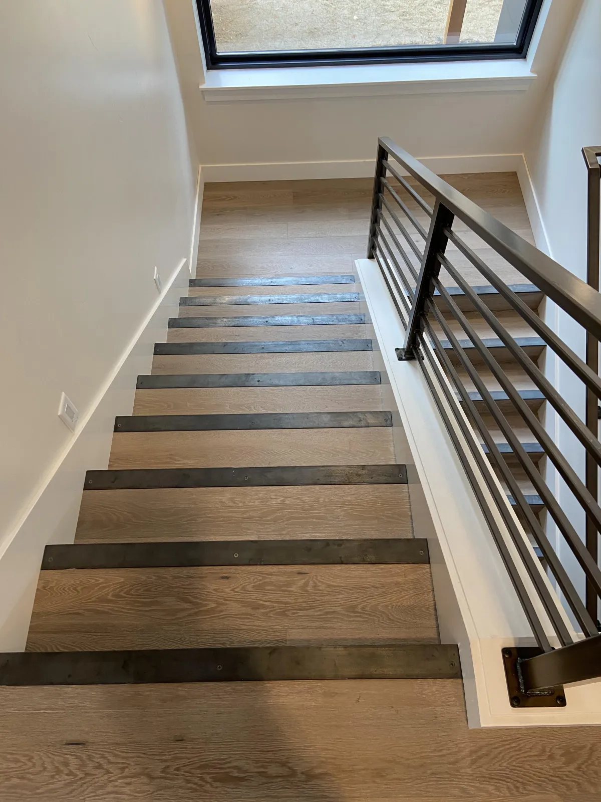 Modern staircase with dark treads