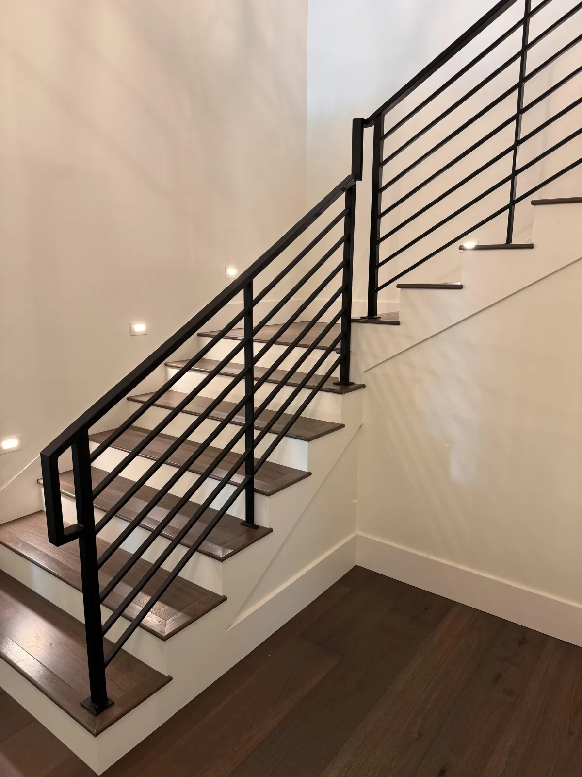 Staircase with black metal railing