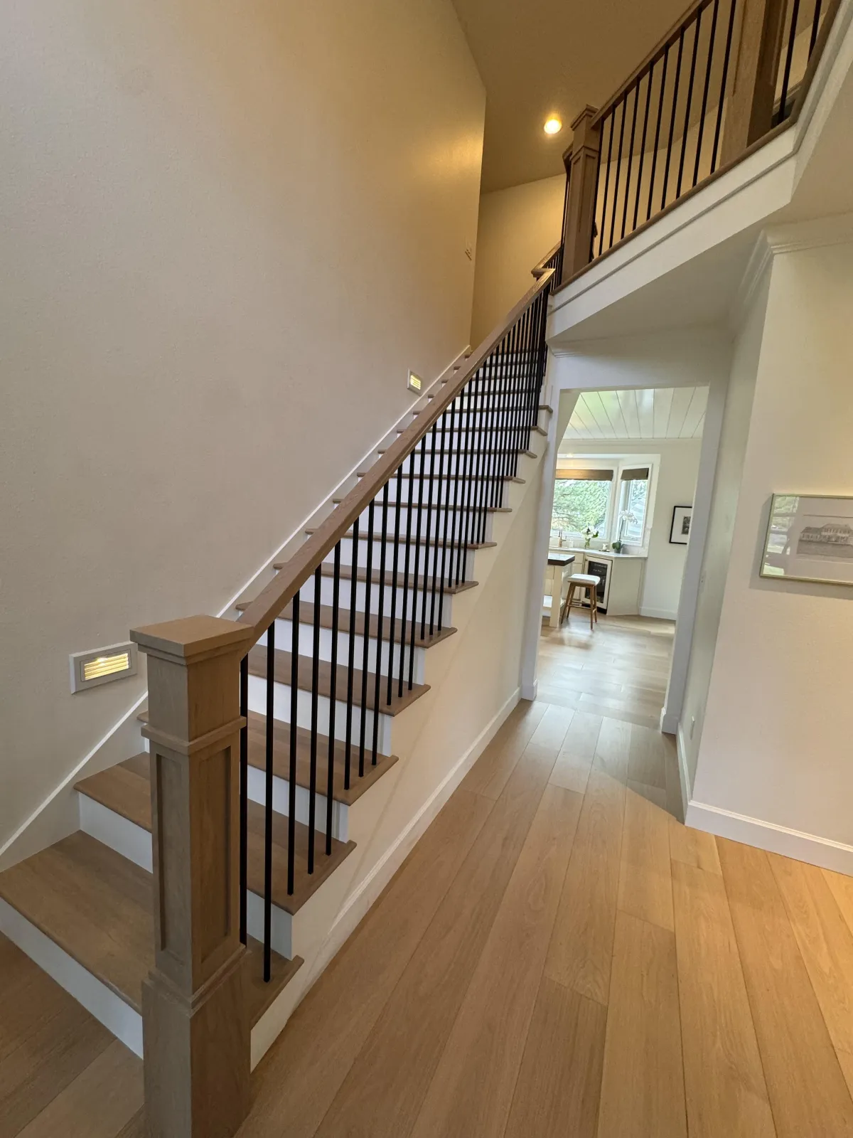 Wood staircase with black railing