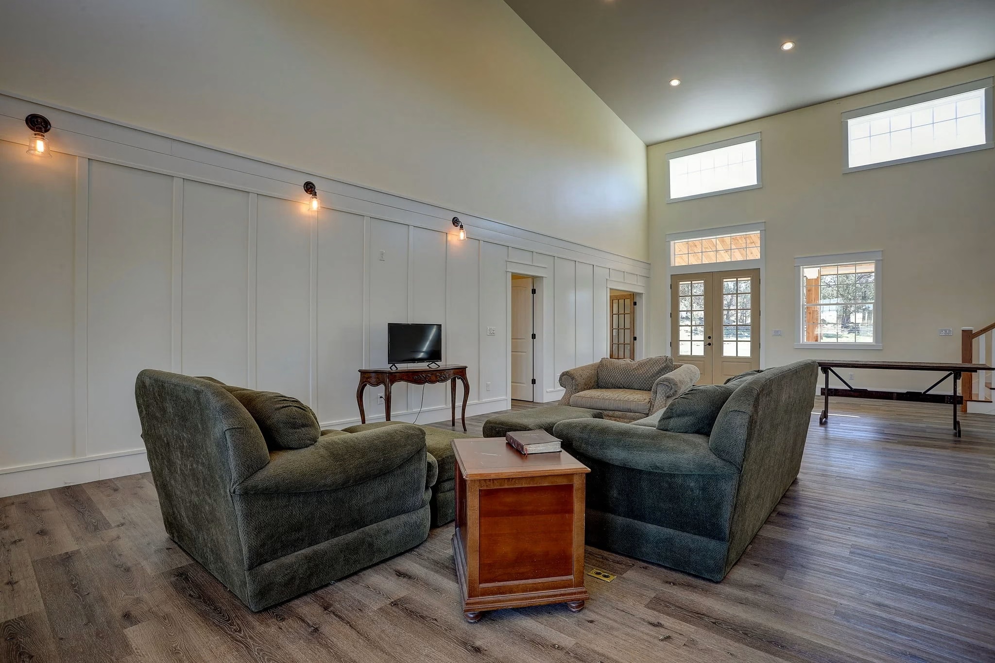 Living room with high ceiling windows