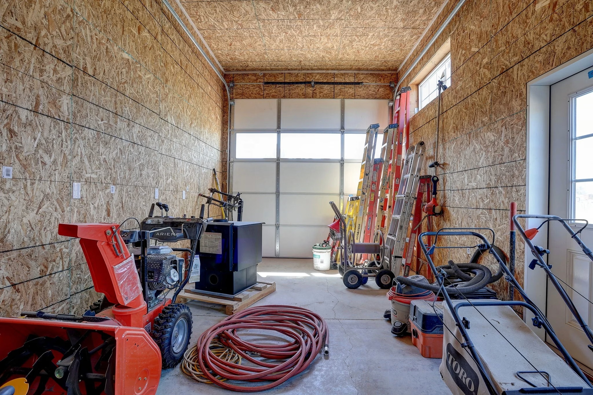 Garage workshop with barndominium carpentry