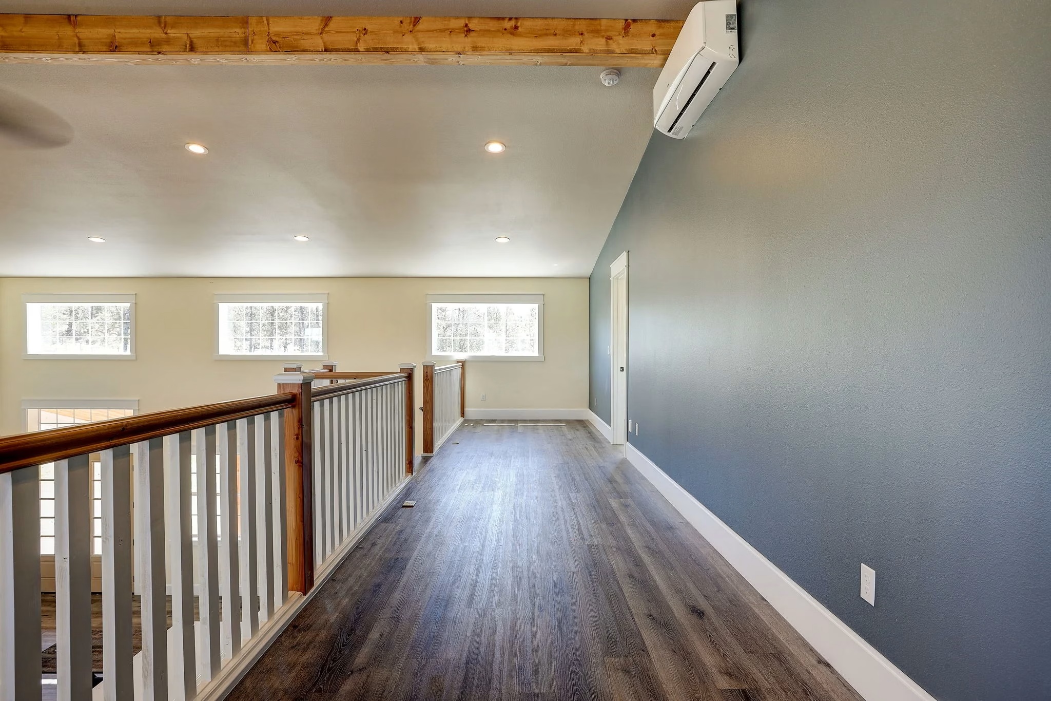 Hardwood flooring with metal railing