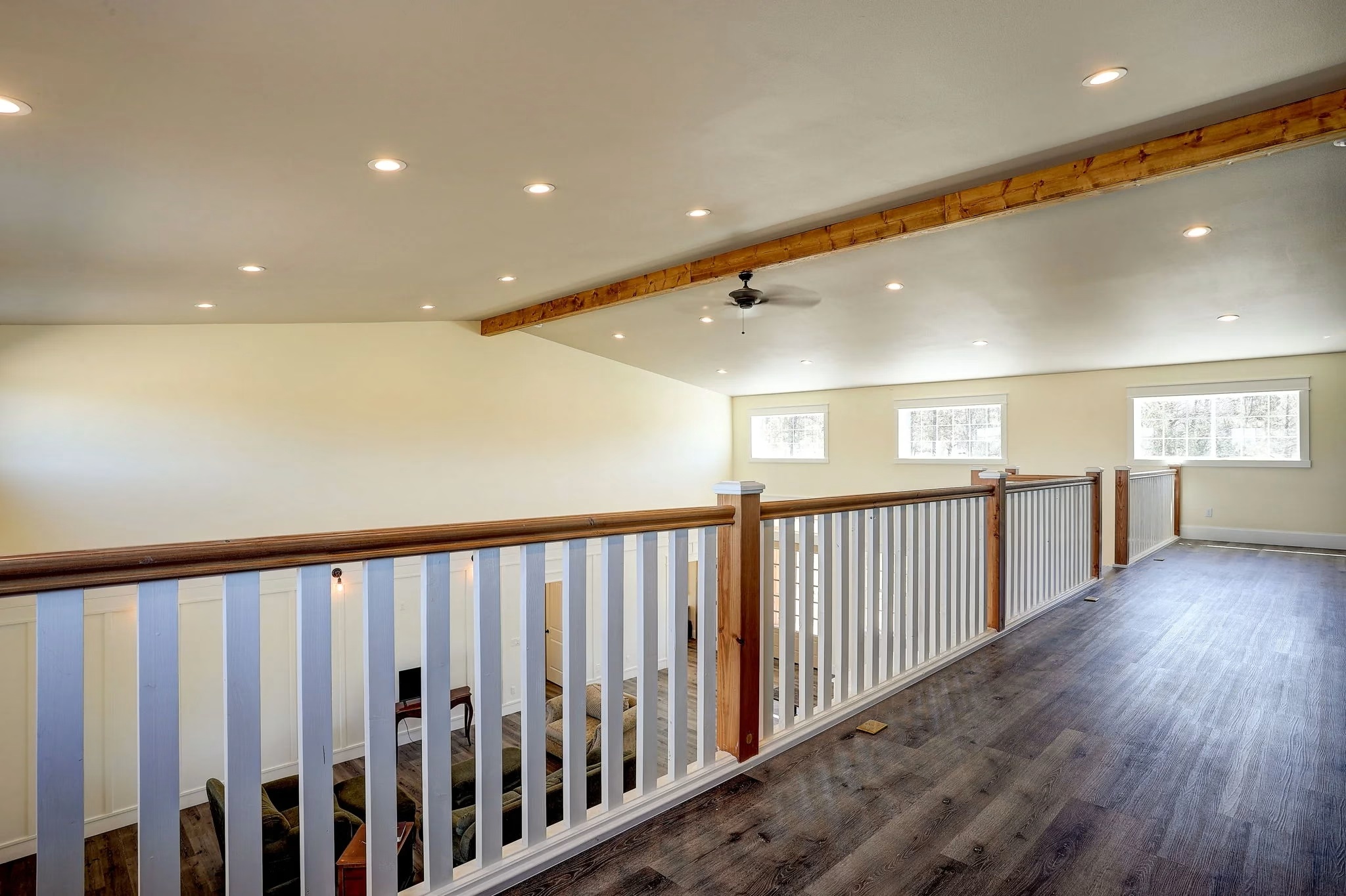 Living area with wood beam ceiling