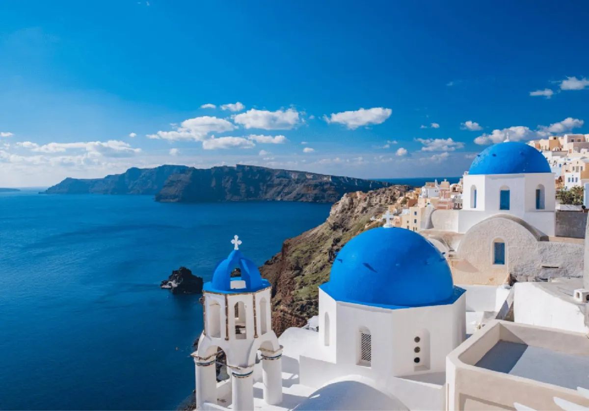 Image of Greece blue domed buildings with an ocean view