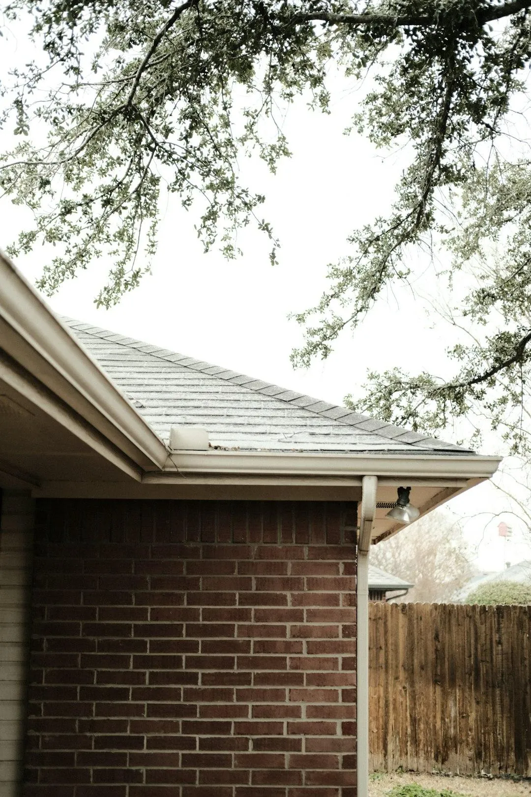 A photo of residential gutters on a residential roof.