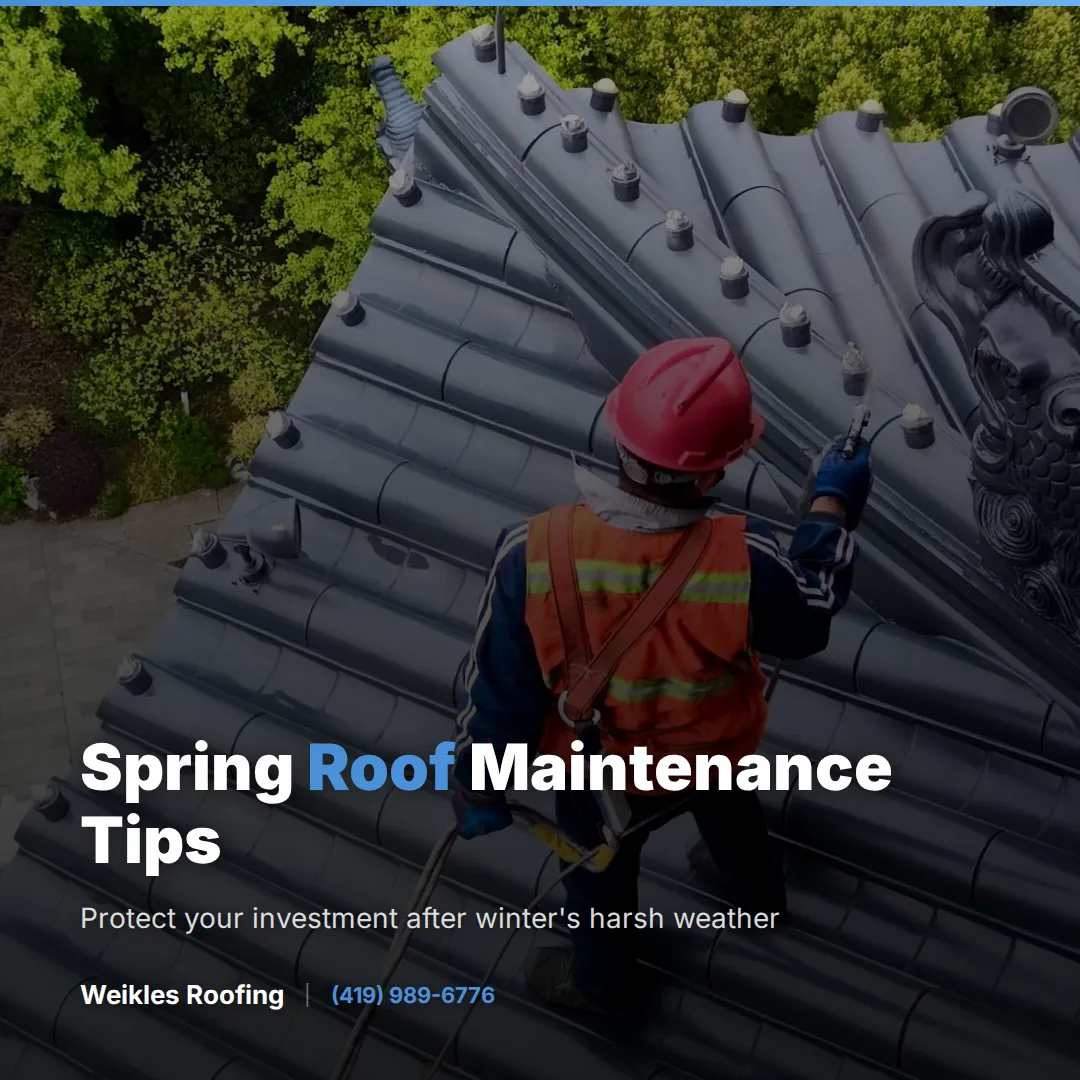 Weikles Roofing crew members actively working on a steep residential roof replacement project, with materials and equipment staged below on a beautiful sunny day. - Weikles Roofing