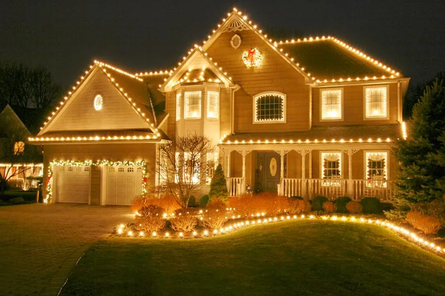 a christmas tree is lit up in front of a building