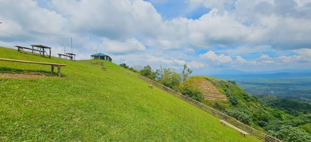 Local farmers and visitors walking through upland fields in Tigbao