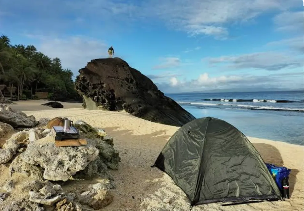 Natural rock formations and tide pools with clear water at Ba Tonying Beach Resort
