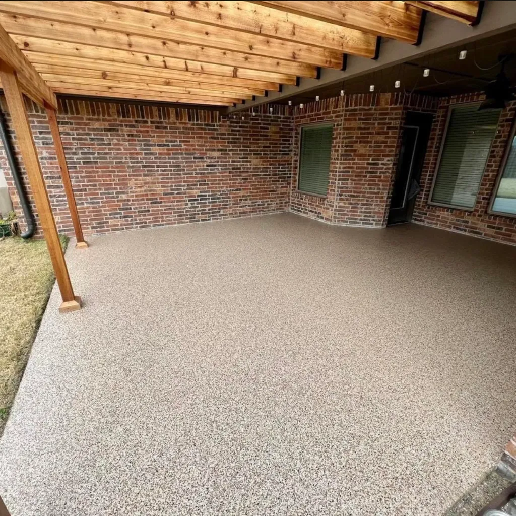 Weather-resistant concrete coating on Minnesota patio with decorative flake finish