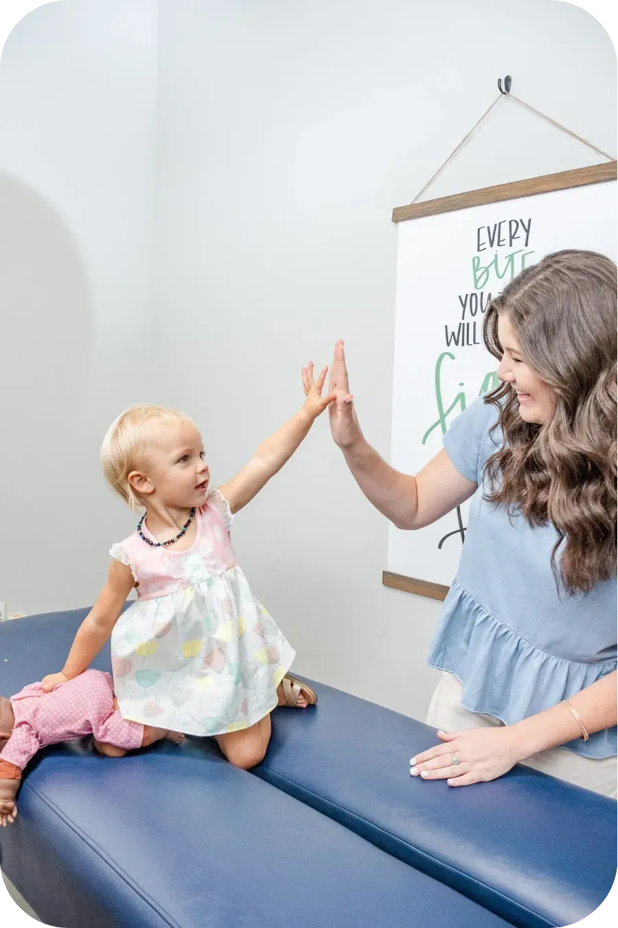 Dr. Haley high-fiving toddler