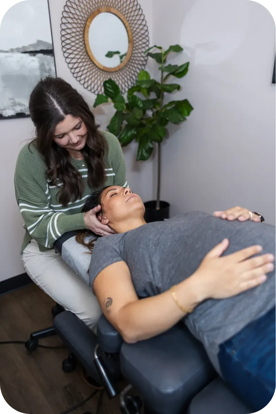 Dr. Haley doing neck work on expecting mother