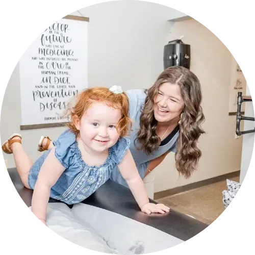 Dr. Haley Turpin, pediatric chiropractor in Broomfield, adjusting an infant.