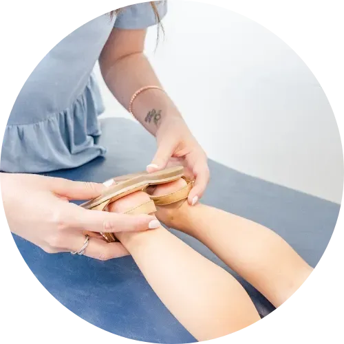 Dr. Haley Turpin, chiropractor, checking hip alignment on toddler