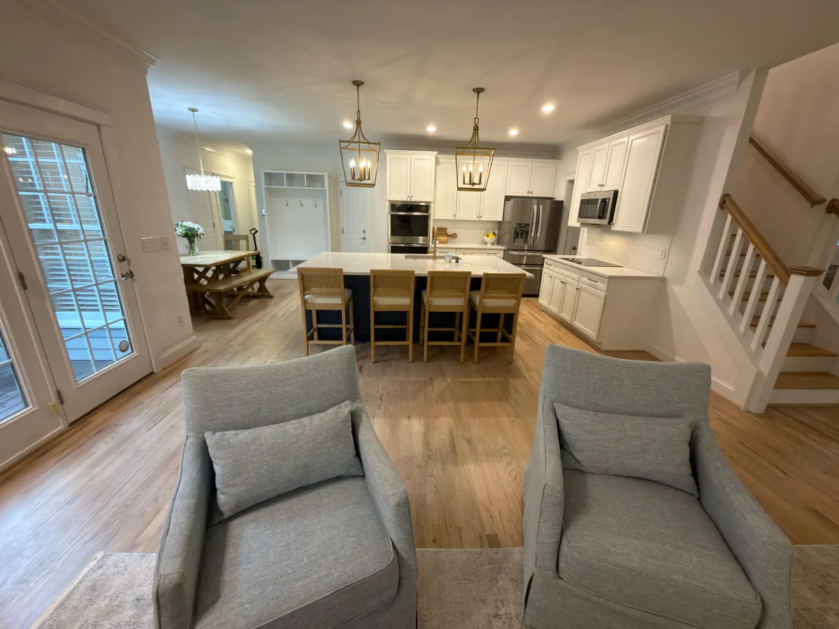 Premium kitchen renovation with custom cabinetry, modern lighting, and spacious island