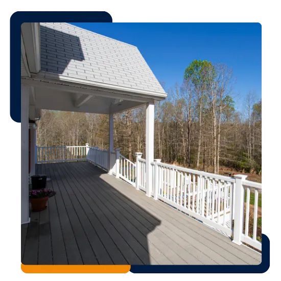 Deck replacement contractor repairing boards and railings on a home deck