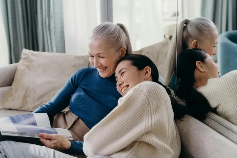 An elderly woman having a meaningful interaction with her companion care caregiver, provided by Sumner In-home Care and Preferred Care at Home