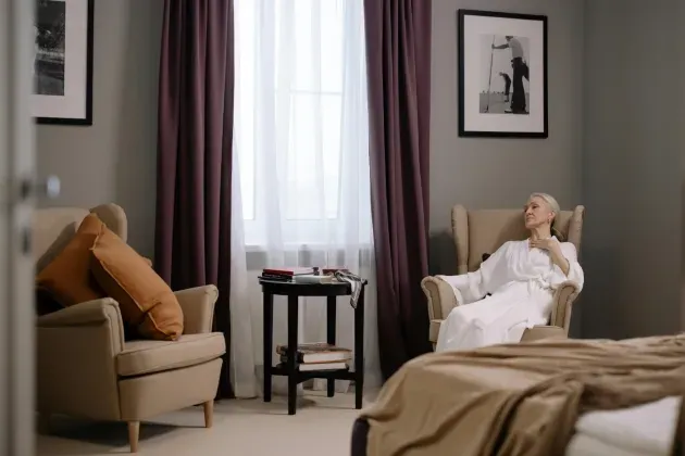 A woman resting in a chair after her hospitalization with transition care provided by Sumner In-home Care and Preferred Care at Home