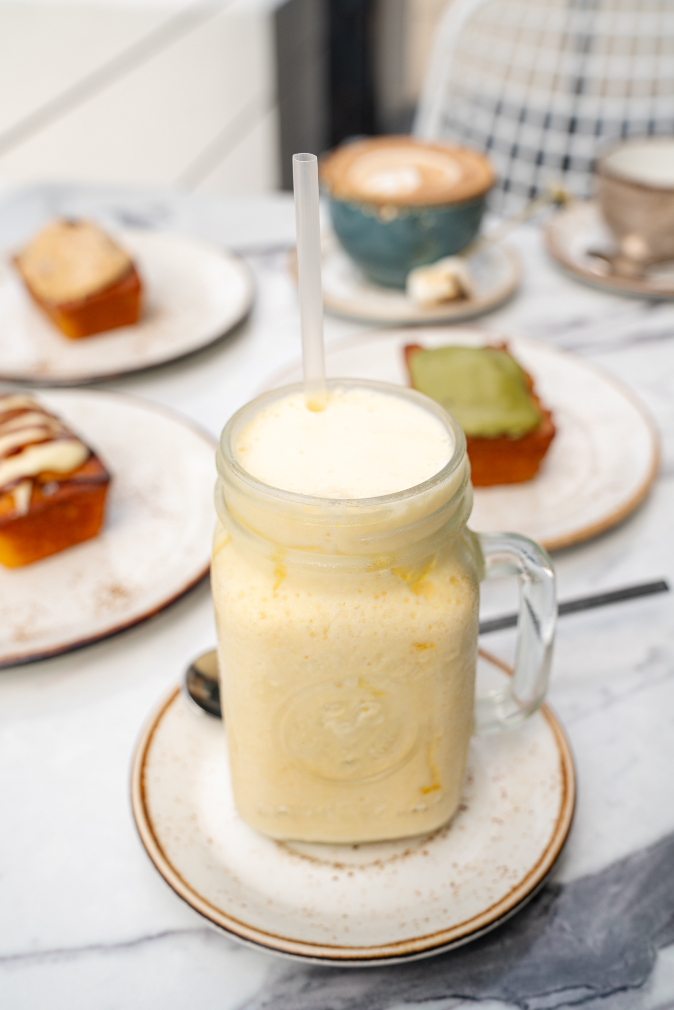 Iced Aussie coffee in a mason jar at The Aussie Grind Provisions café