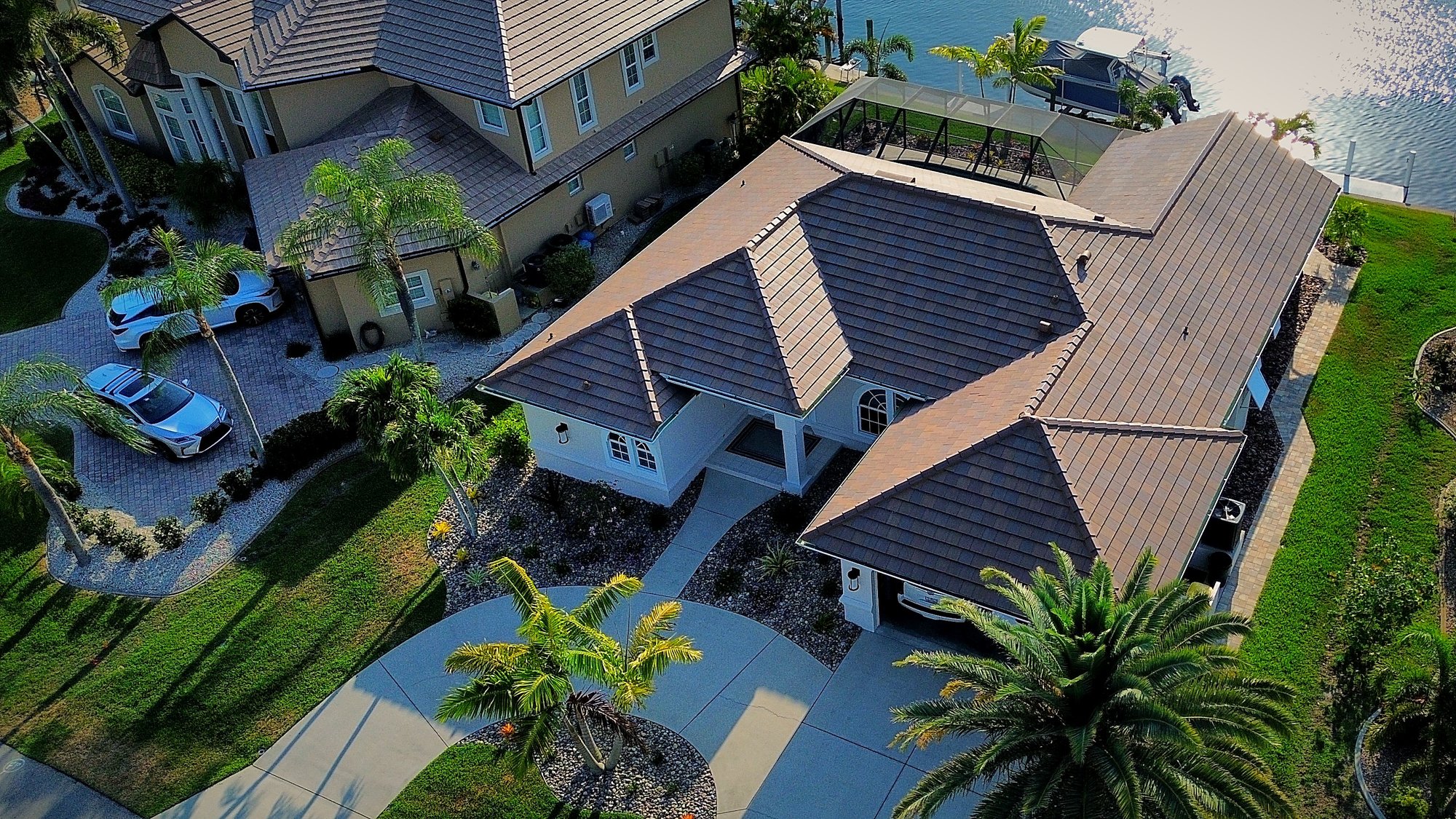 Aerial view of a tile roof Shea Roofing LLC completed on a Punta Gorda Isles canal home