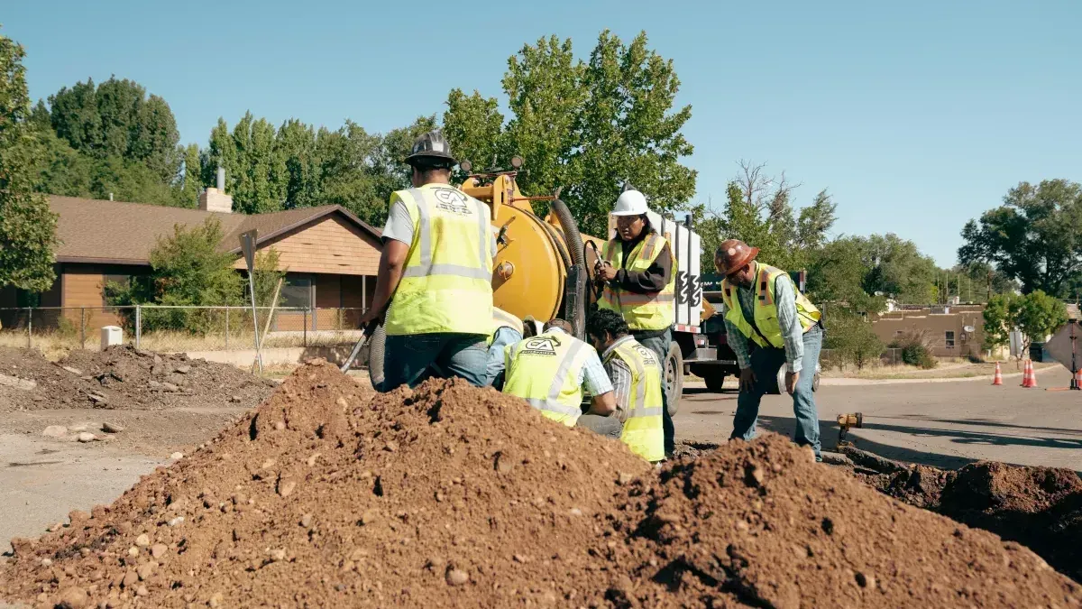Workers digging a septic system
