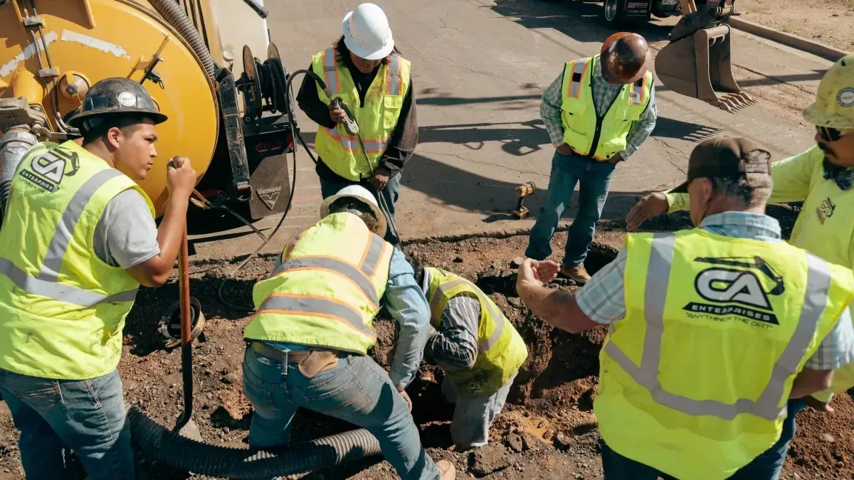 Workers digging a utility trench
