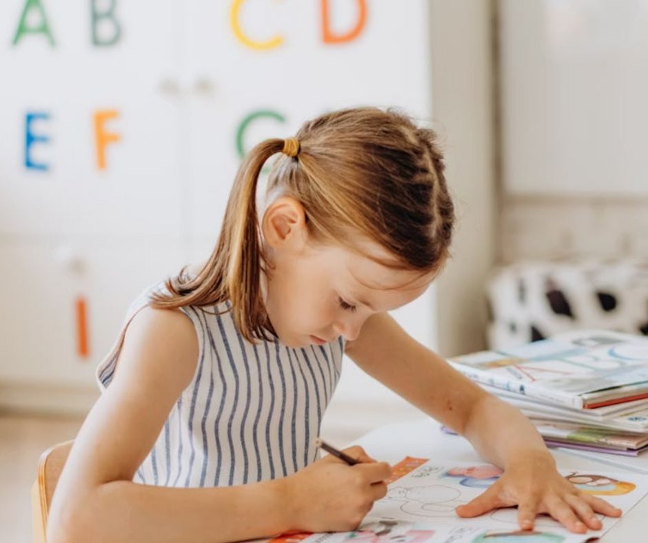 Stressed teen resting head on books — executive function struggles