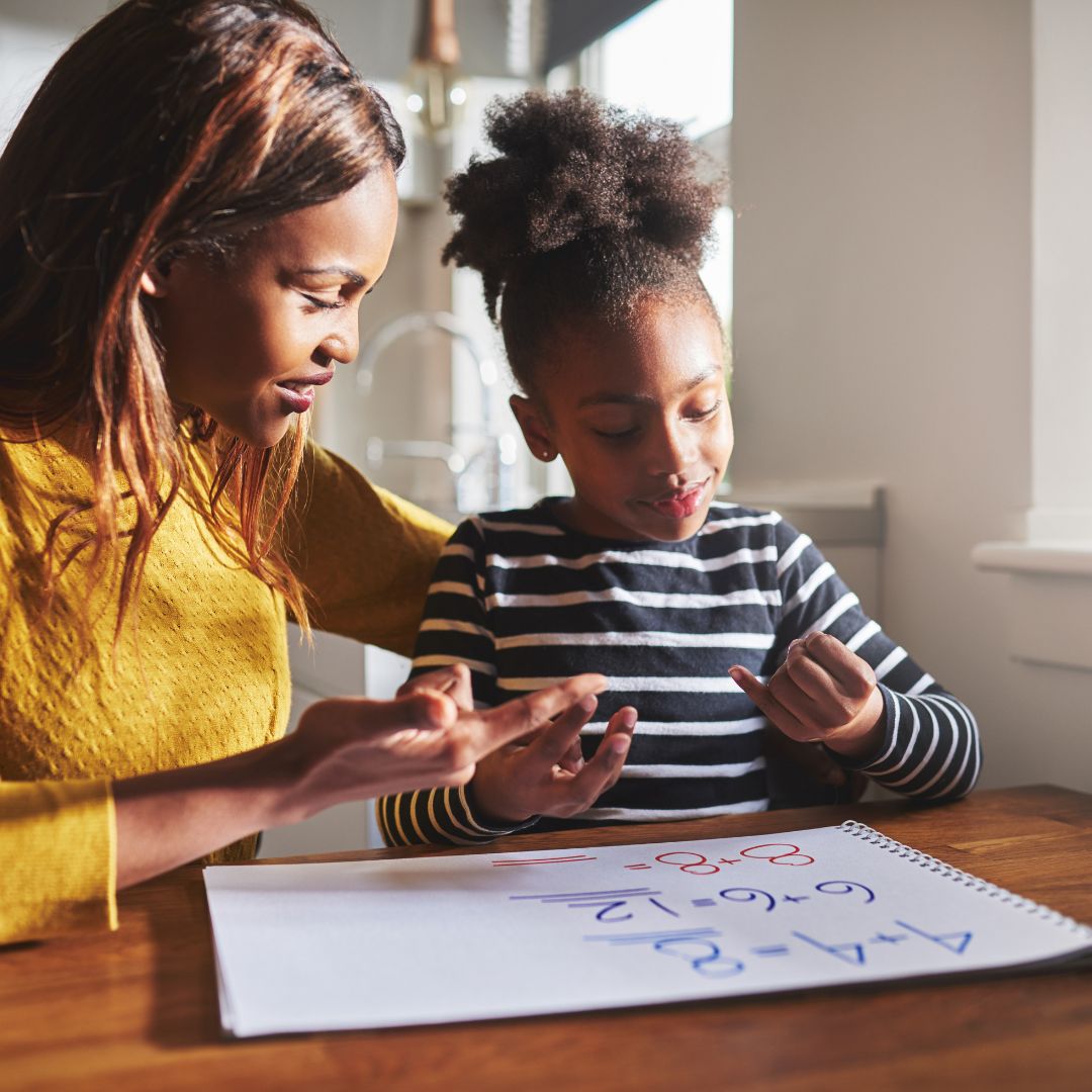 Stressed teen resting head on books — executive function struggles