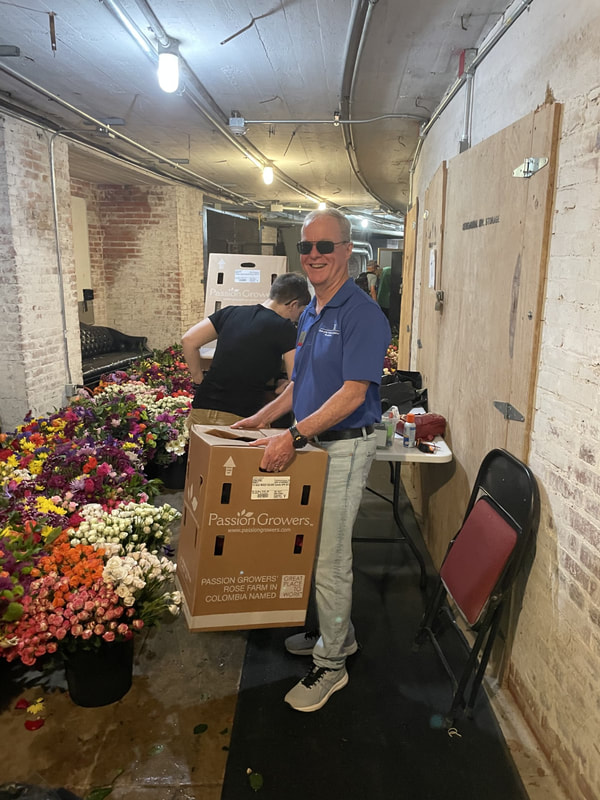 Volunteers prepping flowers at the Flowers of Remembrance event