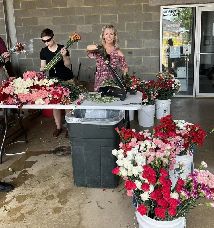 Volunteers prepping flowers at the Flowers of Remembrance event