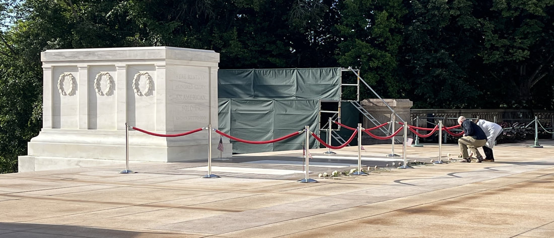 Placing lowers at the tomb