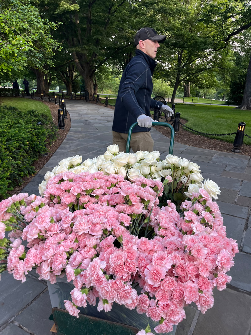 Volunteer delivering flowers at the Flowers of Remembrance event