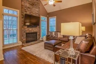 Stone fireplace and hearth in living room