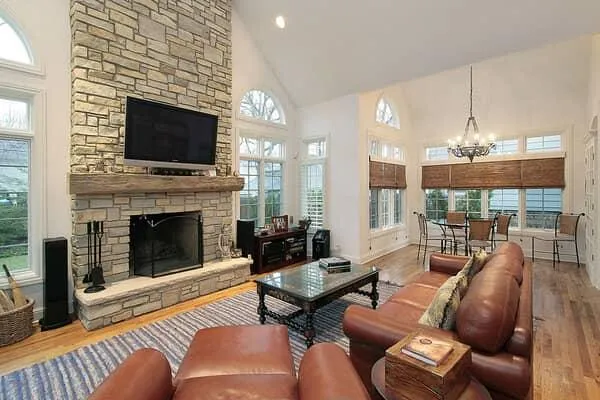 Stone masonry fireplace and mantel in living room