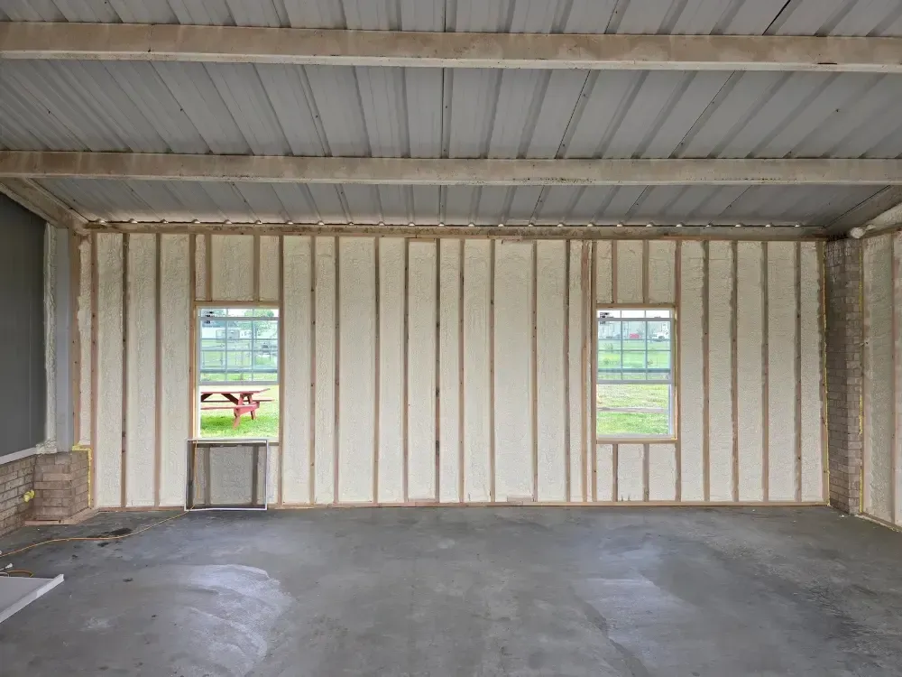 Closed-cell spray foam insulation applied to metal-framed walls by 903 Spray Foam in Honey Grove, TX