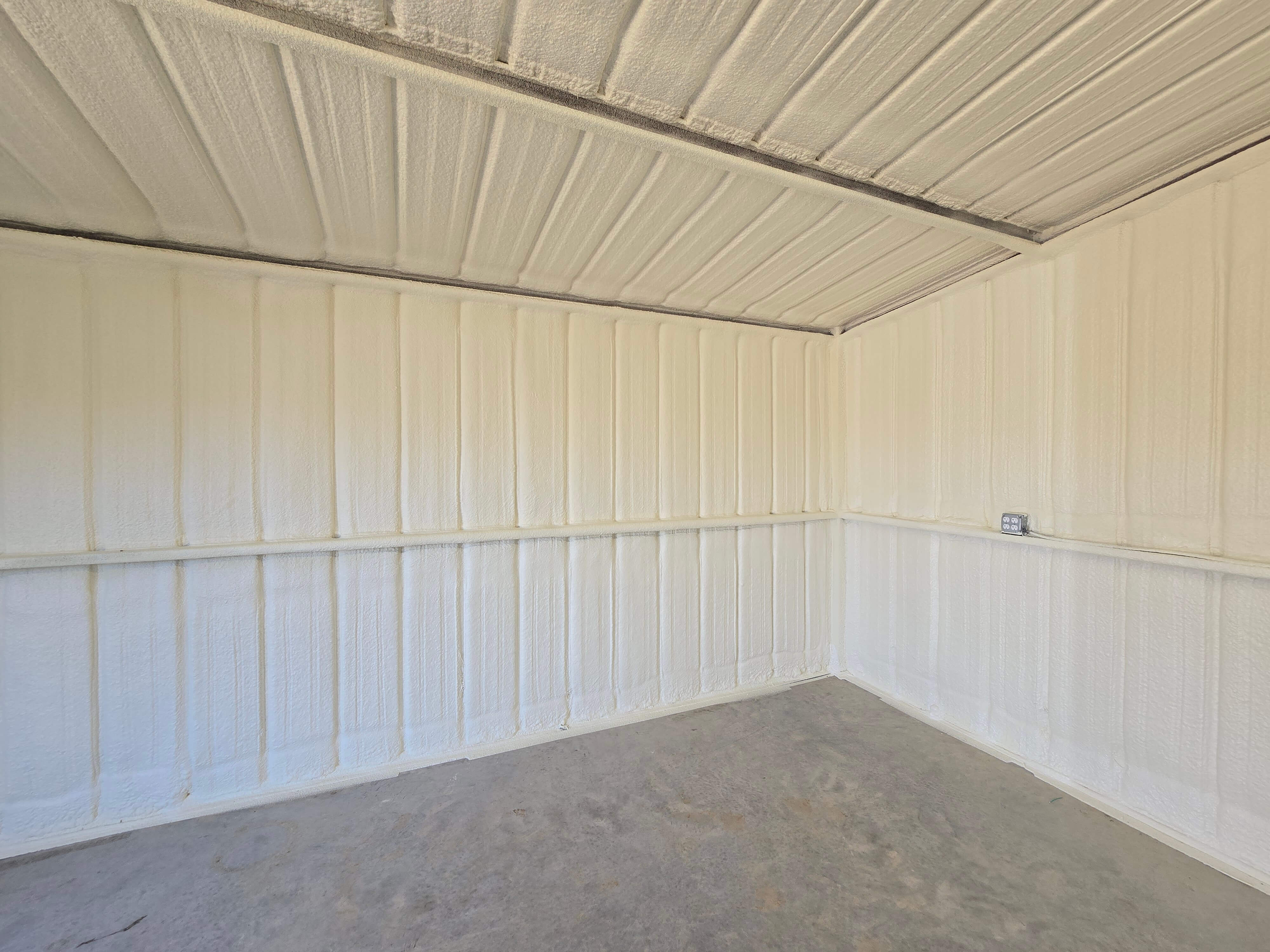 Spray foam insulation being installed in residential wall for energy efficiency in Texas