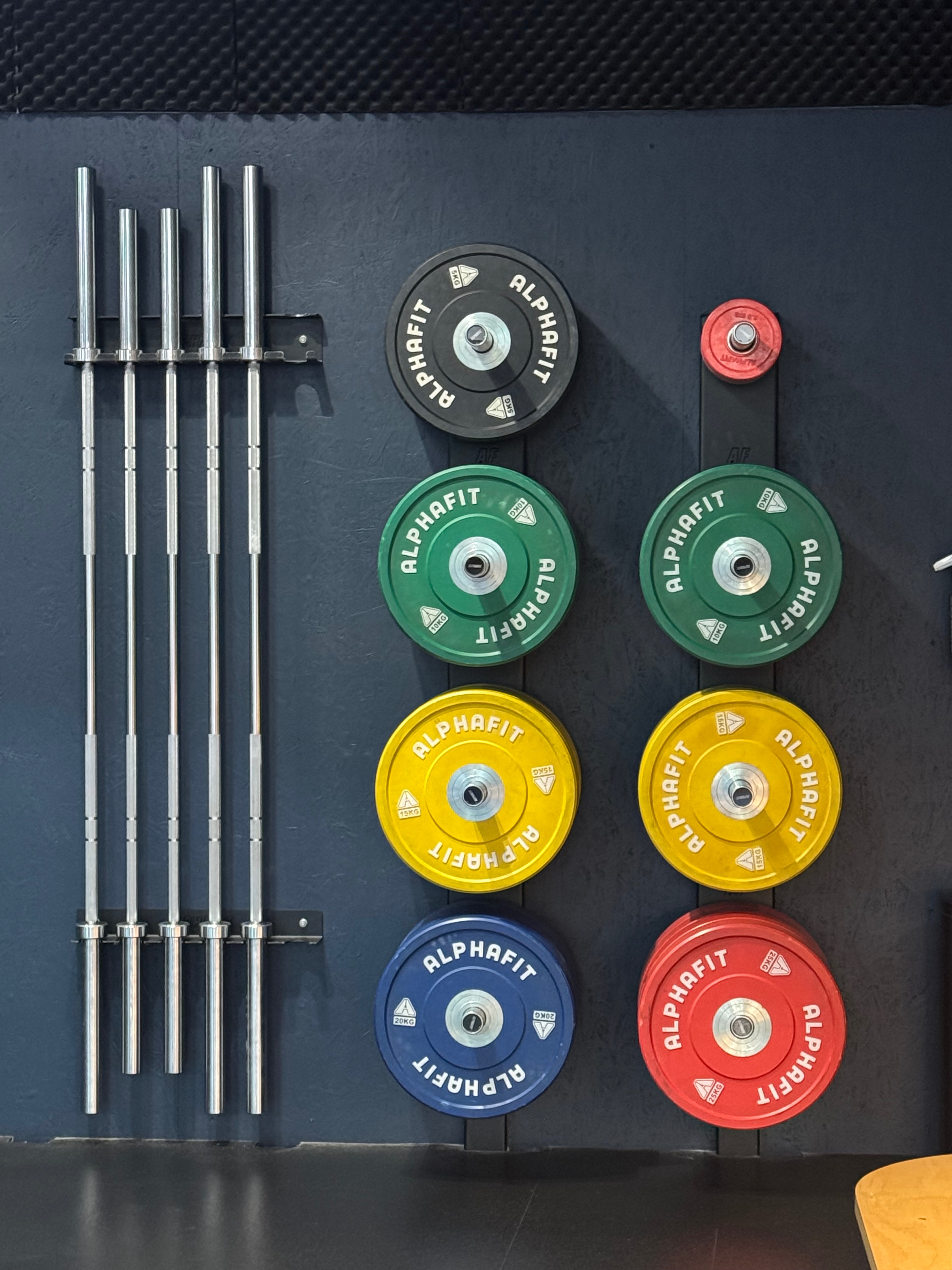 Barbells and colour-coded bumper plates at KGS