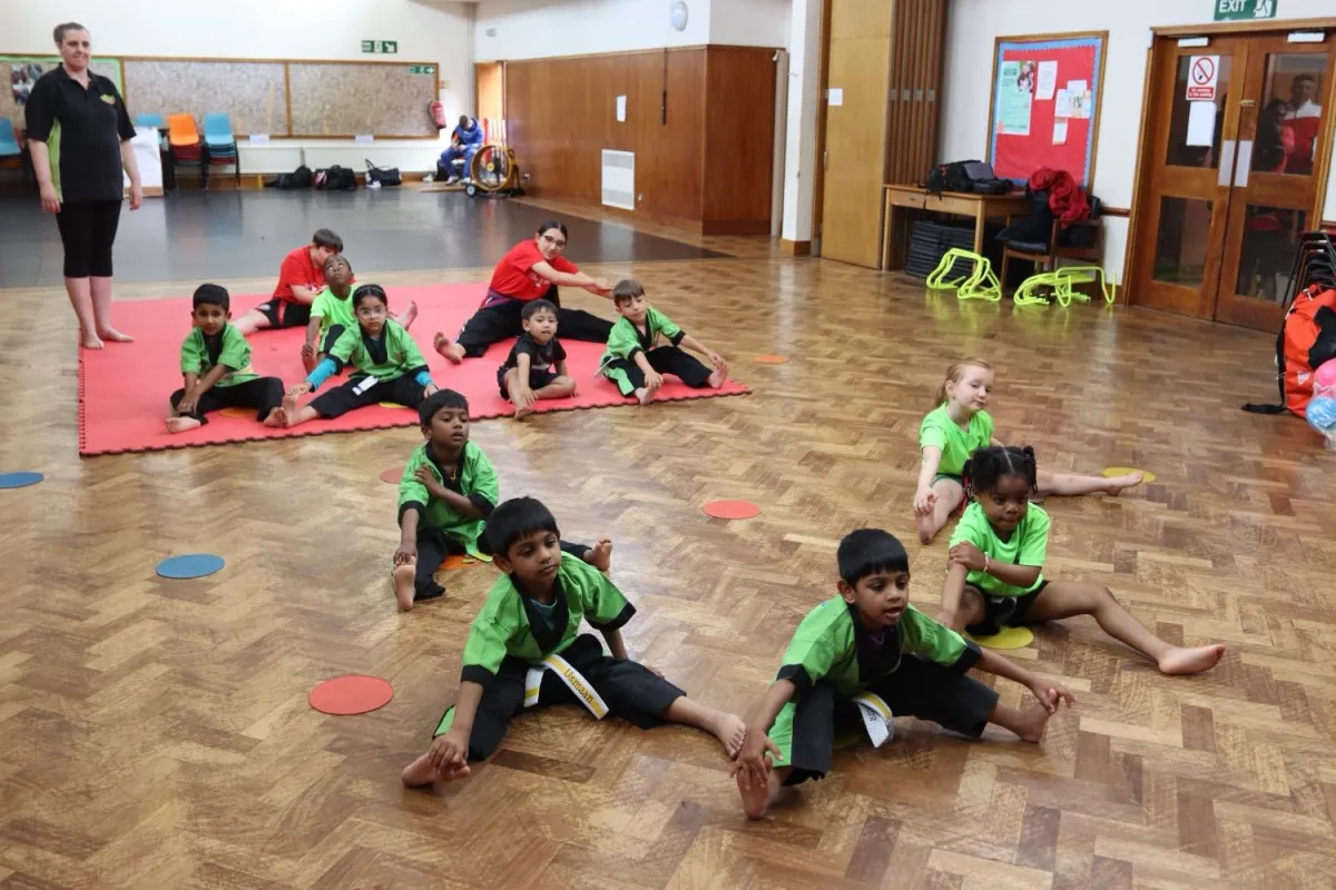 practicing martial arts techniques in Little Monsters class