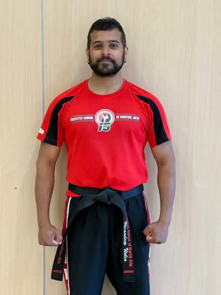 Assistant Instructor Deeps Earning his 1st Degree Black Belt in Kickboxing
