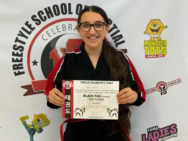 Junior Instructor Nadia Collecting her new belt & Certificate