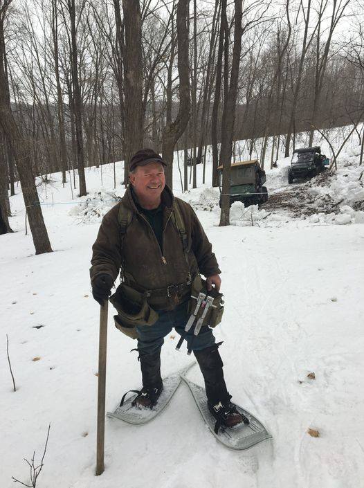 Scott Wood, founder of Wood's Sugar Bush, snowshoeing in the sugar bush
