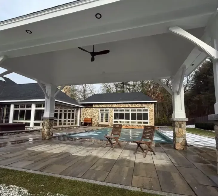 Outdoor pool and hot tub area with professional electrical wiring by Ryan Gath Electric in Westford MA ensuring safe, code-compliant installation