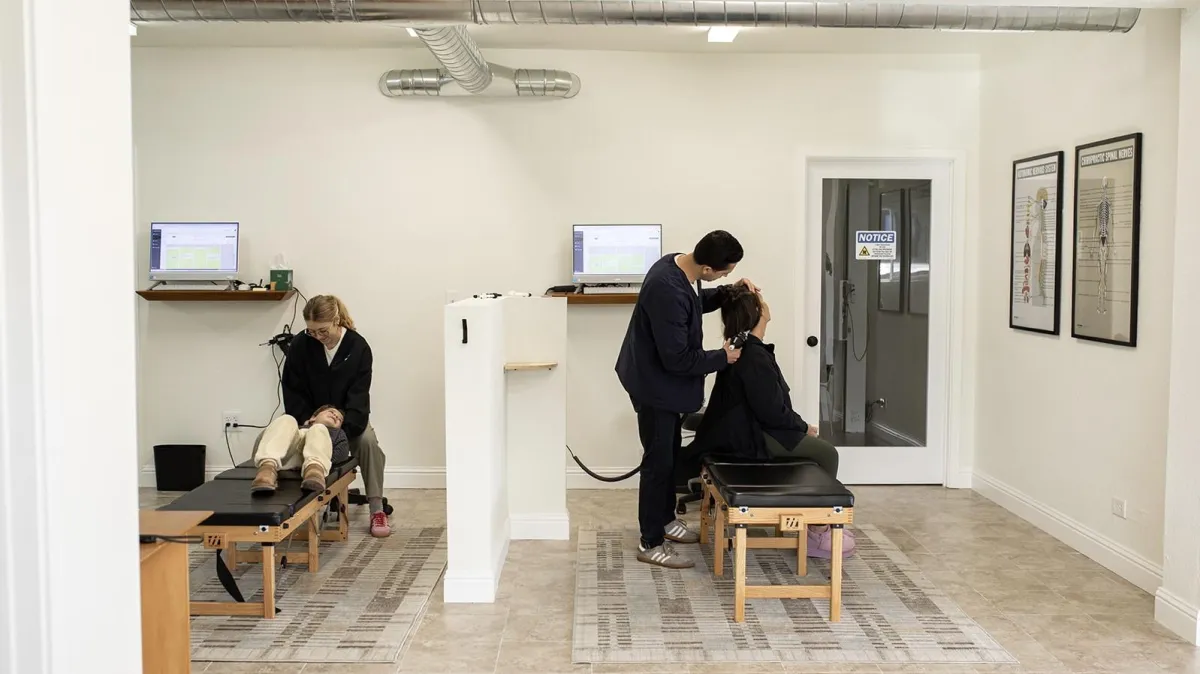 Patient experiencing gentle neck relief in a warm clinical environment