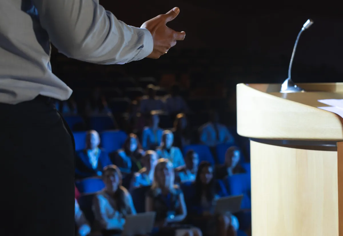 rear-view-of-businessman-giving-presentation