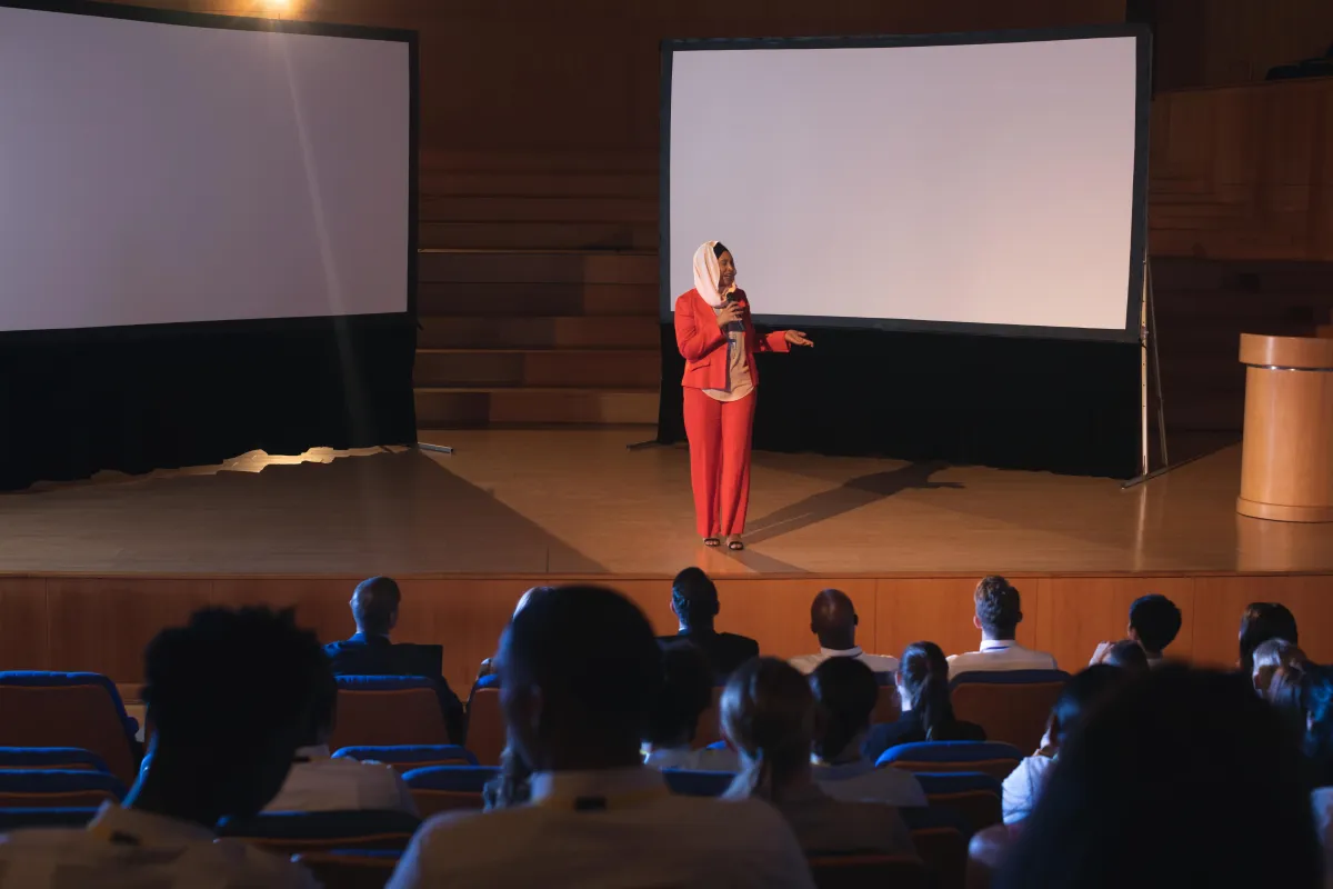businesswoman-standing-and-giving-presentation
