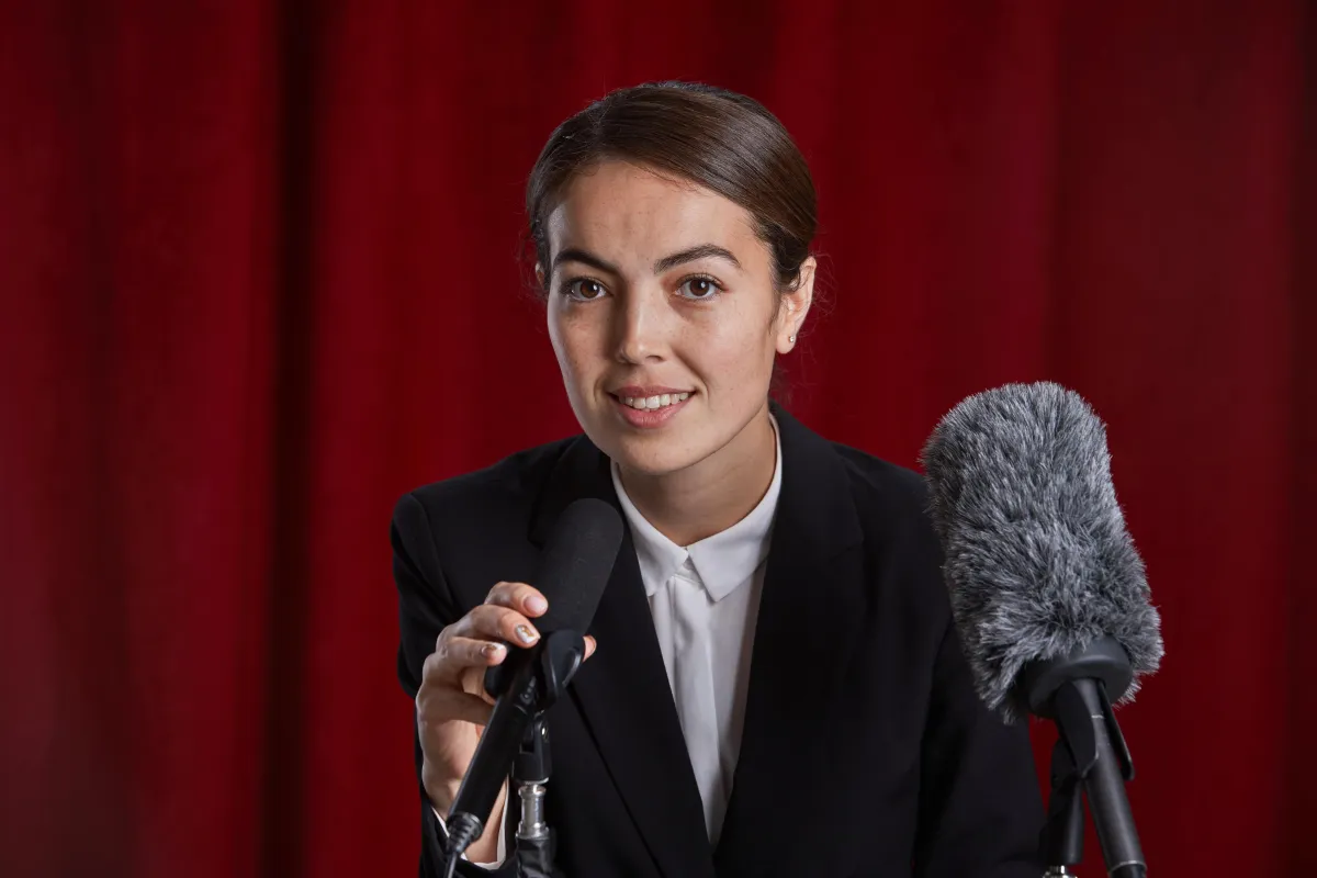 female-speaker-on-stage
