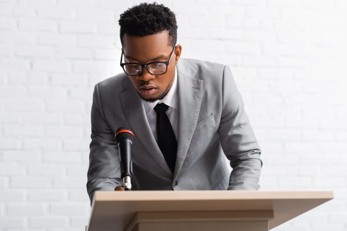 nervous-african-american-speaker-on-business-conferece