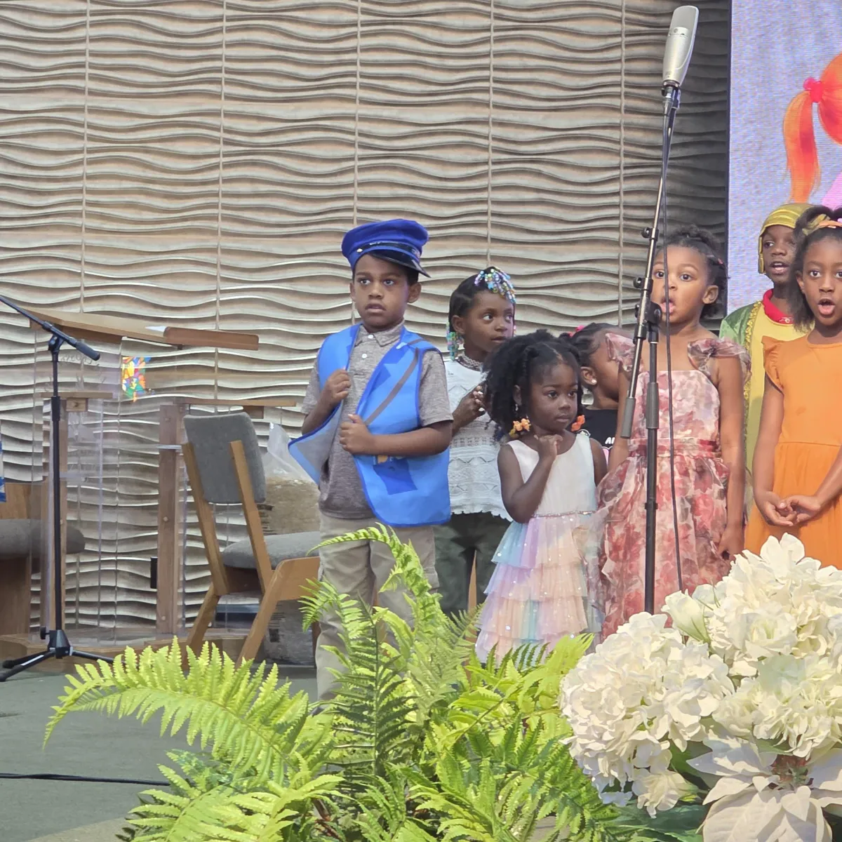 Children and families joyfully participating together in church life and worship at Valley Crossroads